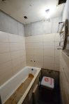 После установки ванны приступаем к укладке плитки